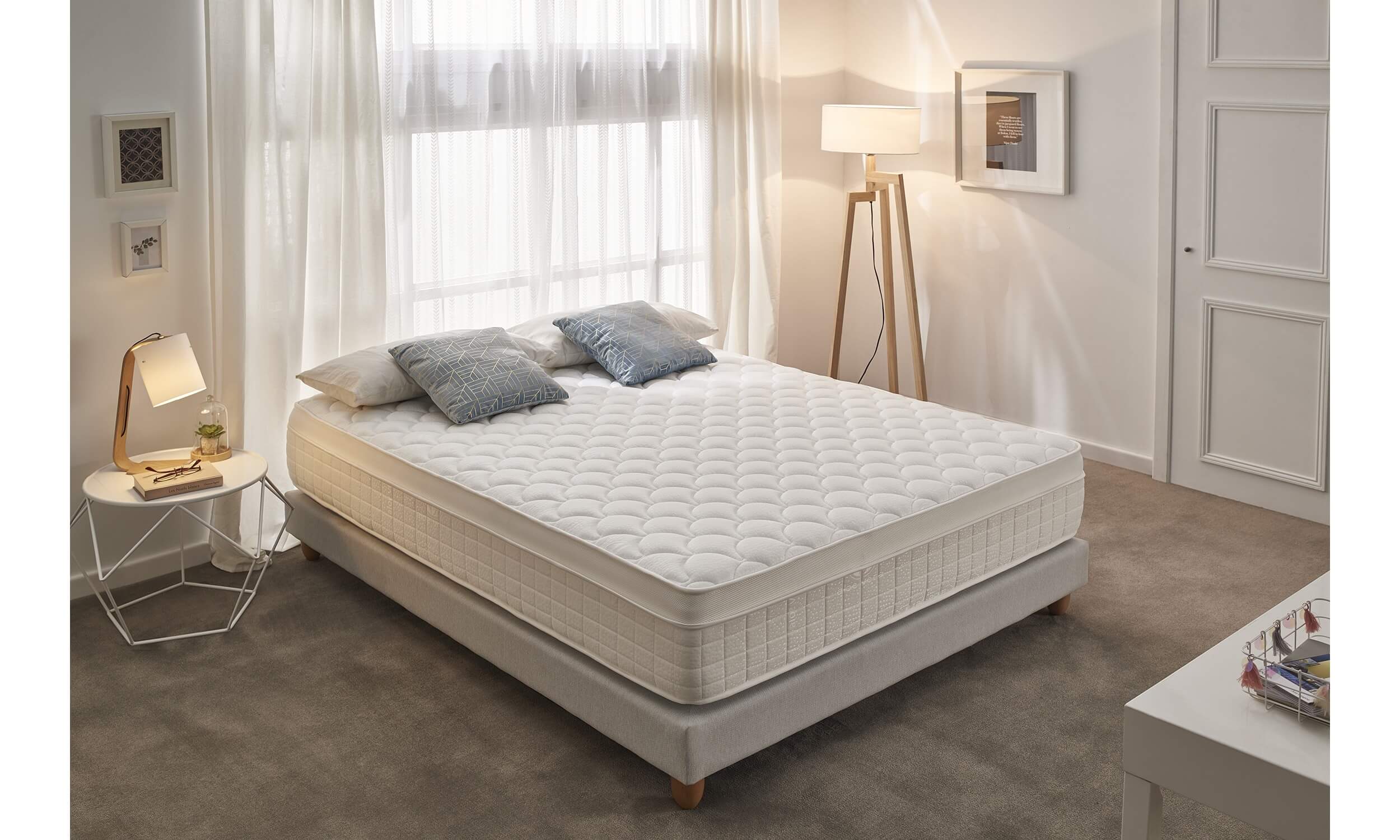 box spring and mattress on floor